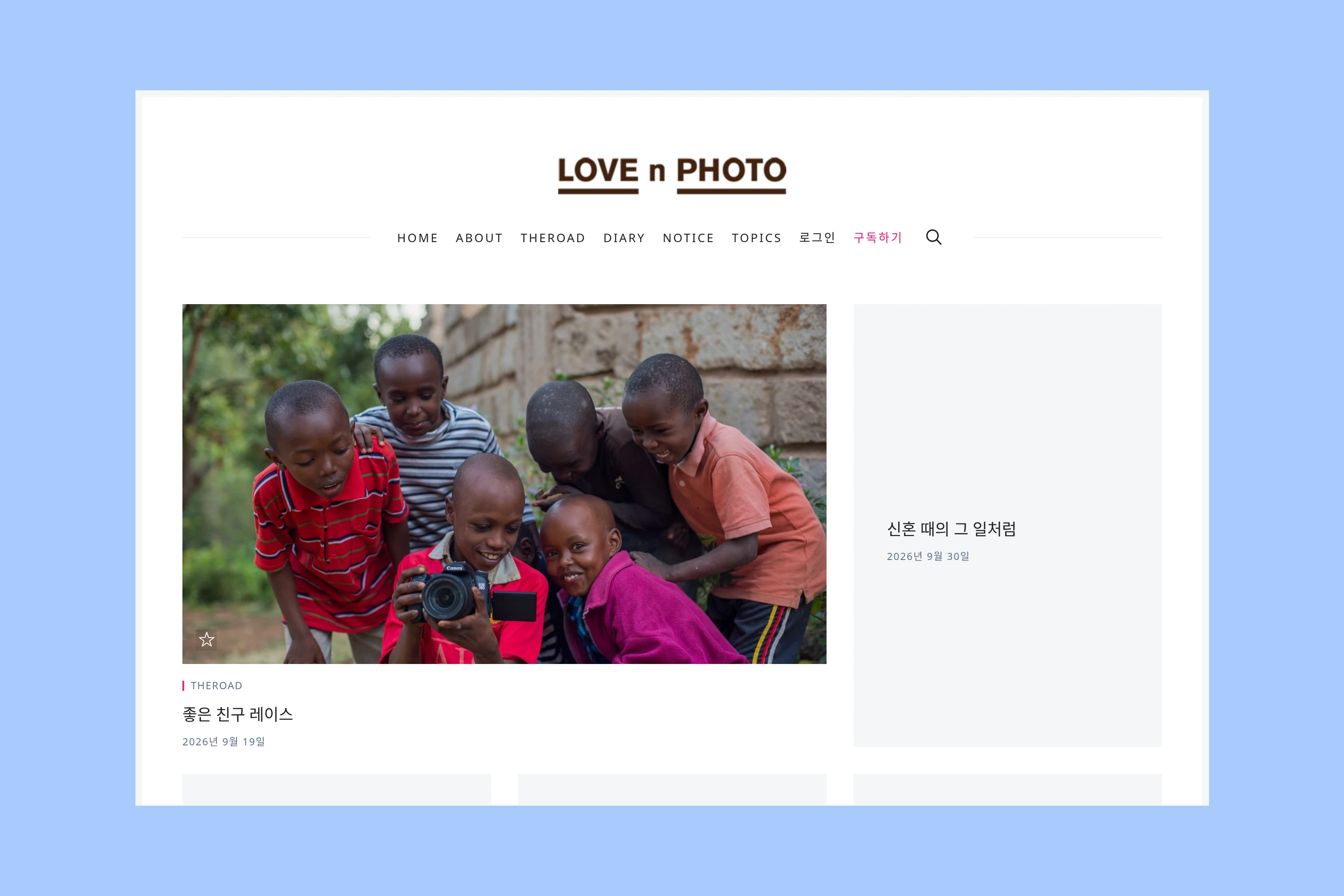 LOVE n PHOTO homepage with a large lead photograph, story title and neighboring text card
